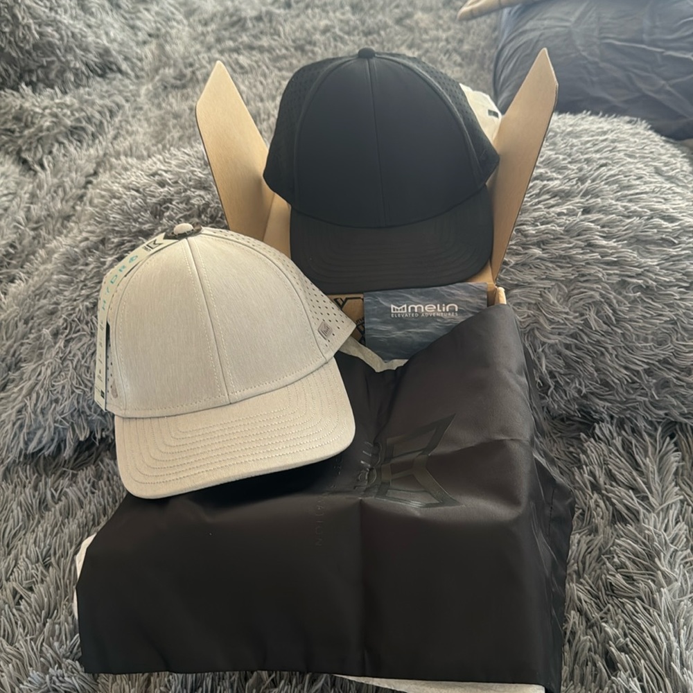 Brand new Merlin hydro hats. One gray one black still in box.